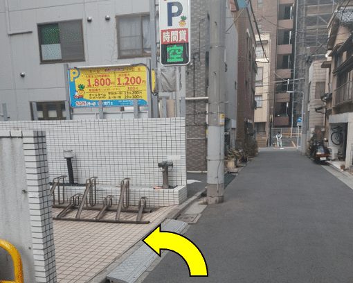 Bicycle parking on the left, arrow pointing left