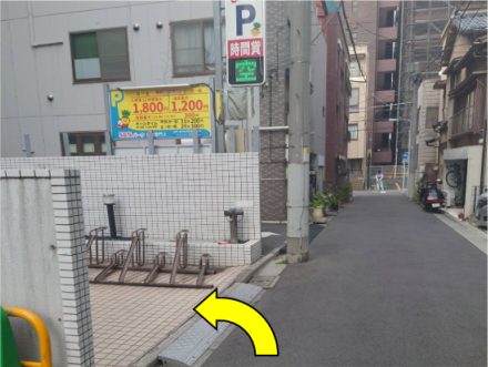 Bicycle parking on the left, arrow pointing left